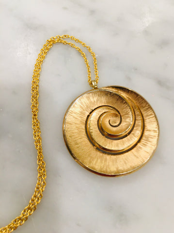 Gorgeous infinity circle necklace, true mid century mod in both brushed and polished gold.