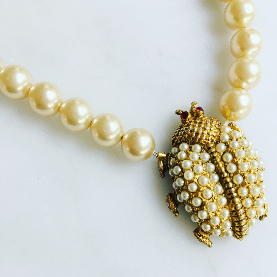 Beautiful pearl and gold ladybug, set by hand